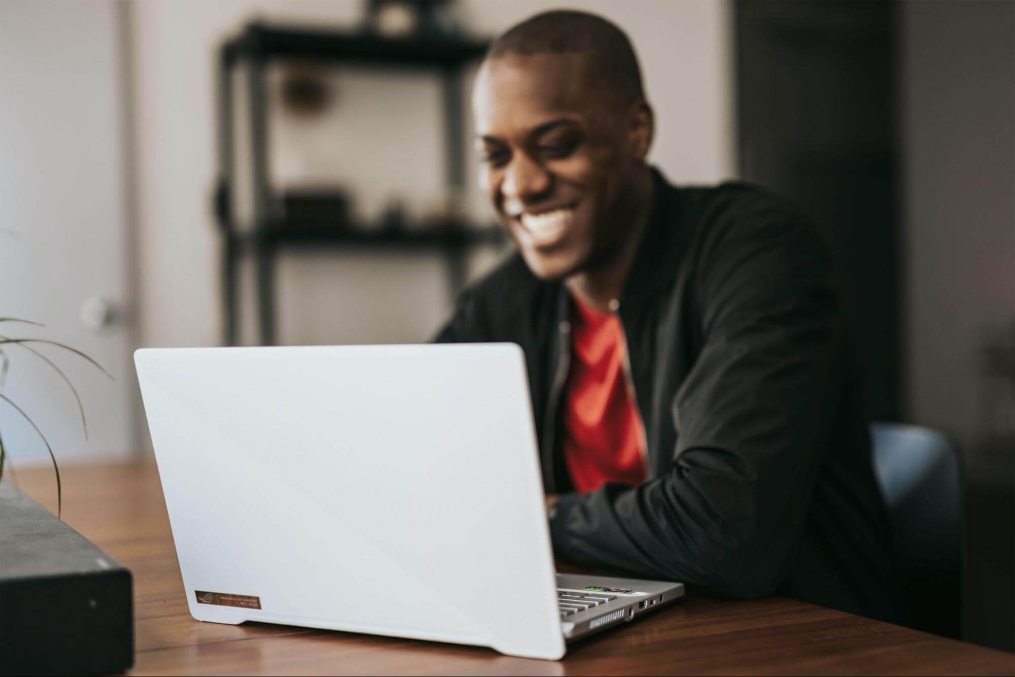 Writer smiling at computer